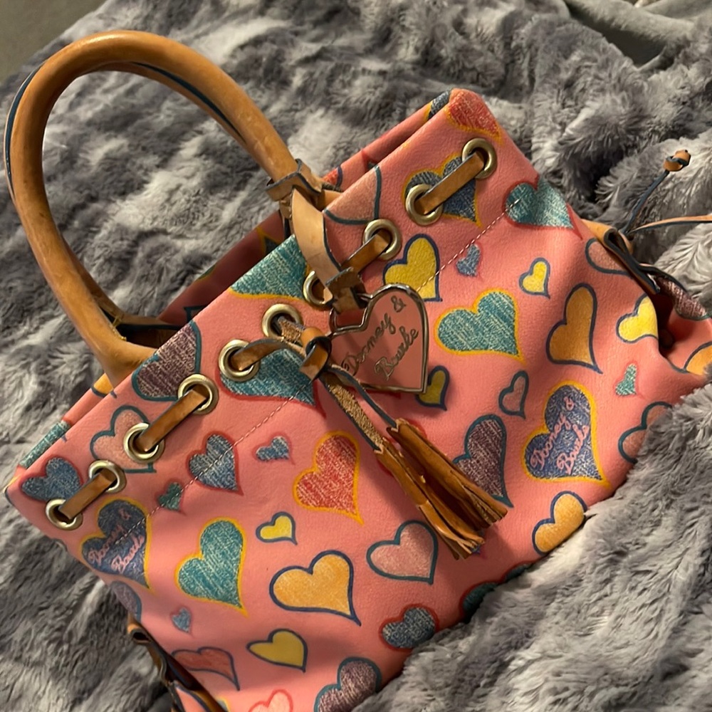 Pink Heart Dooney & Bourke hang bag.